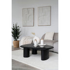 Table basse ovale noire avec pieds cylindriques épais