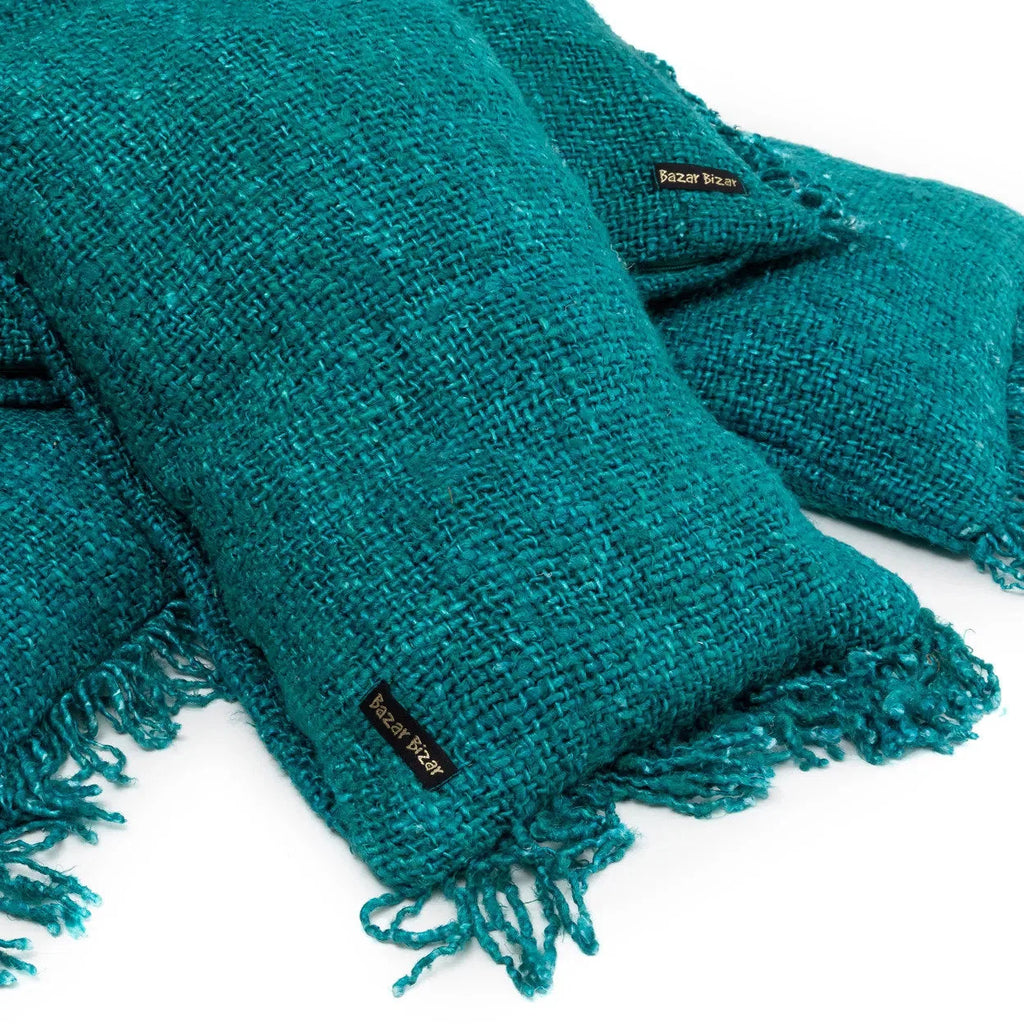 Plaid en coton texturé aqua avec franges, parfait pour la décoration intérieure