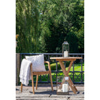 Table pliante en bois clair avec lanternes en métal doré vieilli H35 cm