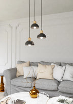 Trois suspensions noires en métal mat avec accents bois, Ø30 cm