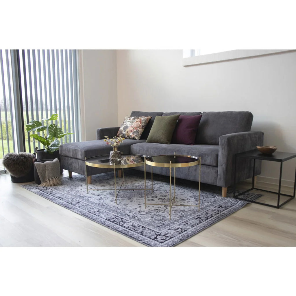 Canapé sectionnel gris velours avec coussins à motifs
