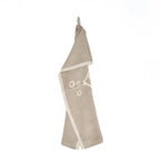 Torchon en lin naturel beige avec motif géométrique blanc et bordure contrastée
